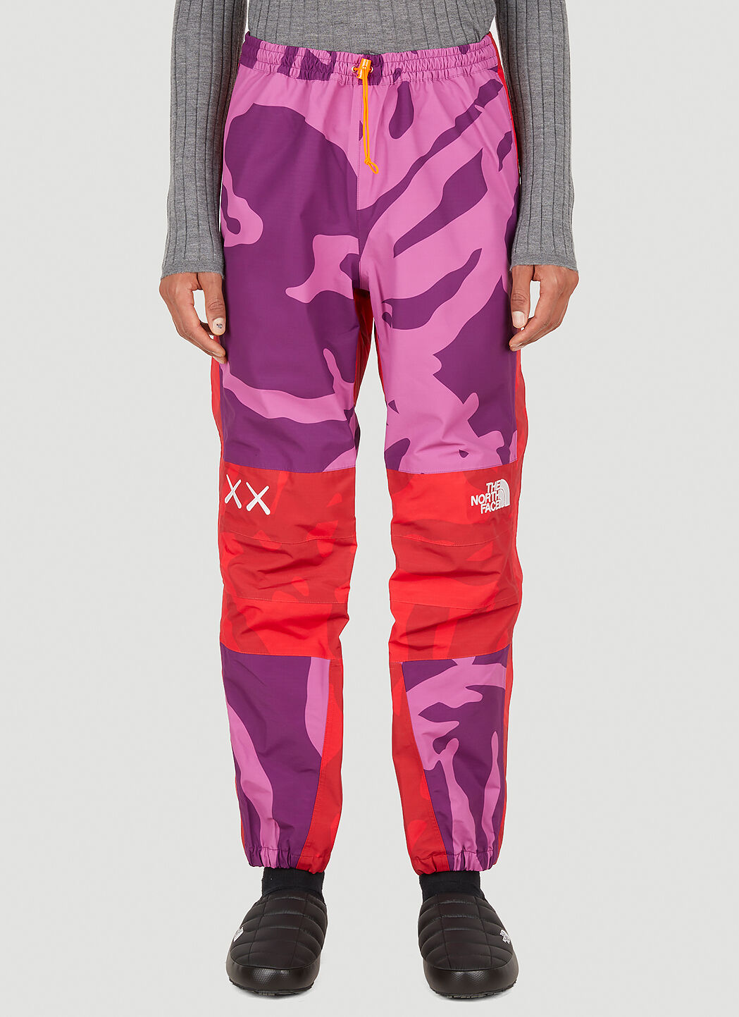 The North Face x KAWS Mountain Light Track Pants in Pink | LN-CC®