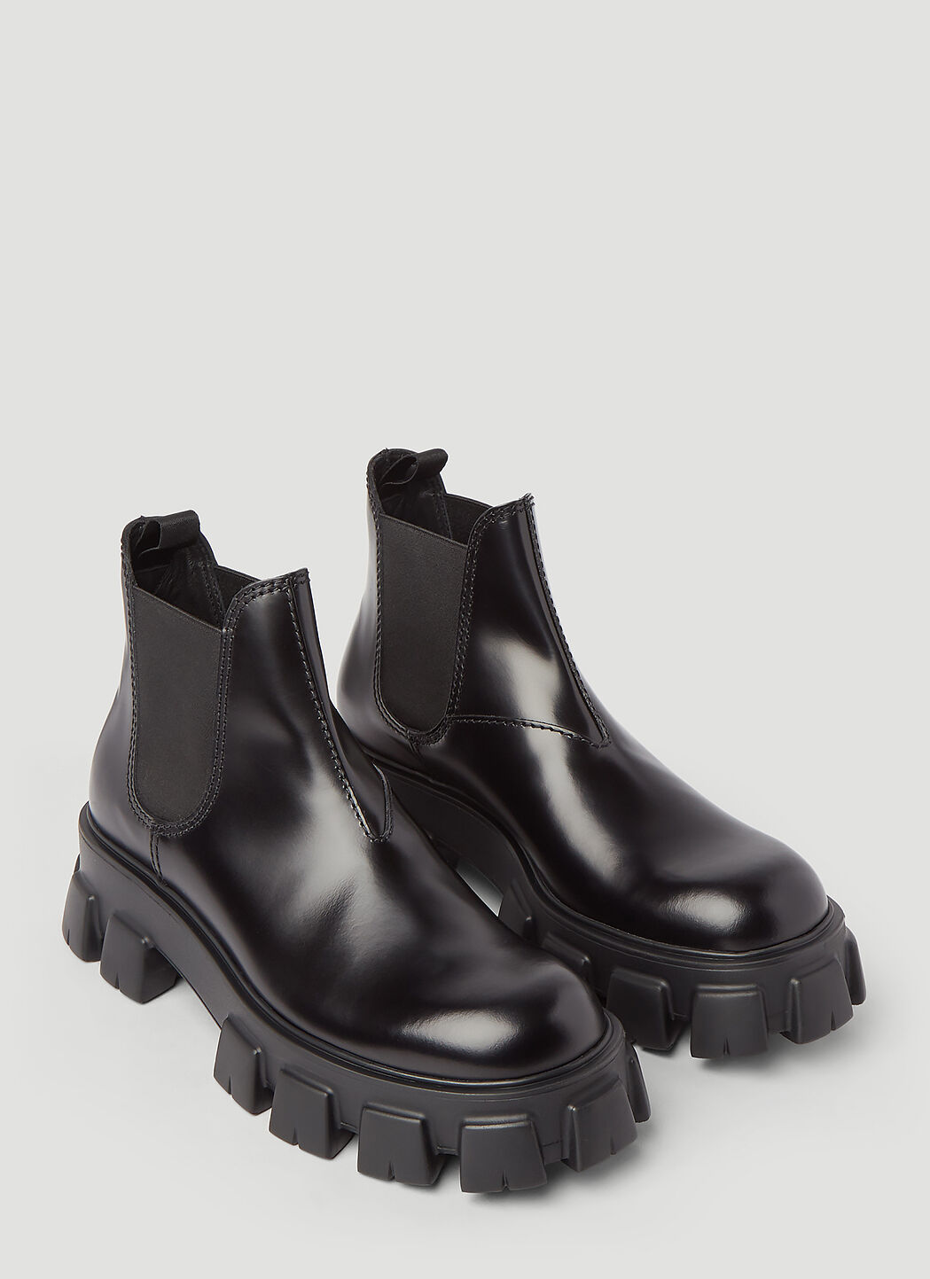 Prada Monolith Leather Chelsea Boots in Black LN CC