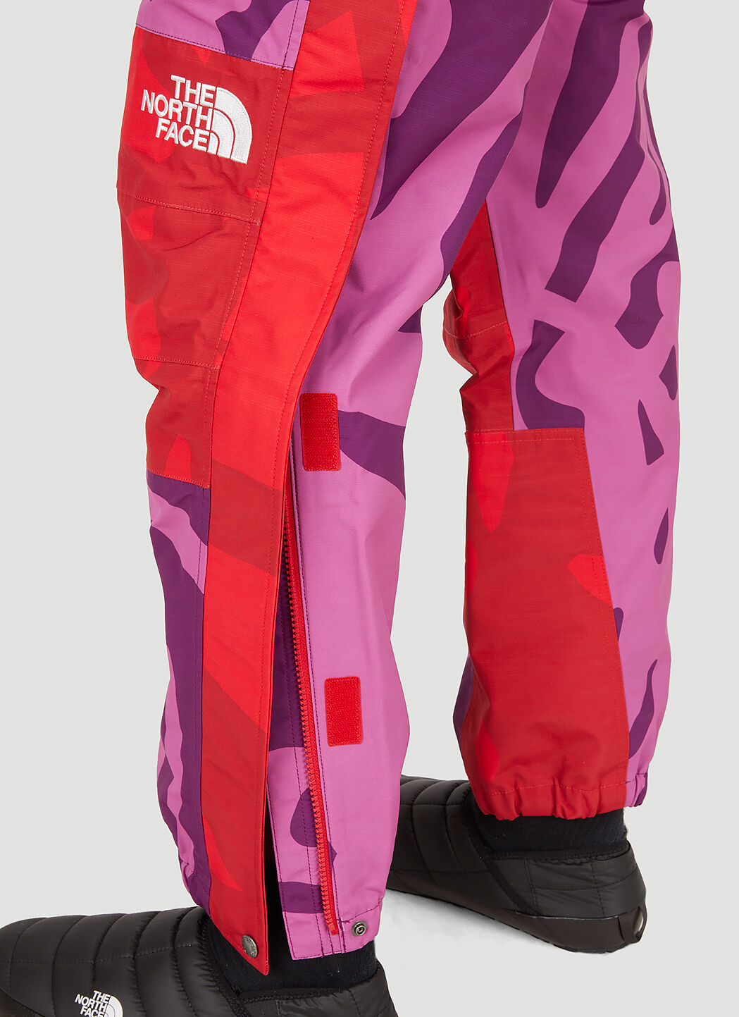 The North Face x KAWS Mountain Light Track Pants in Pink | LN-CC®