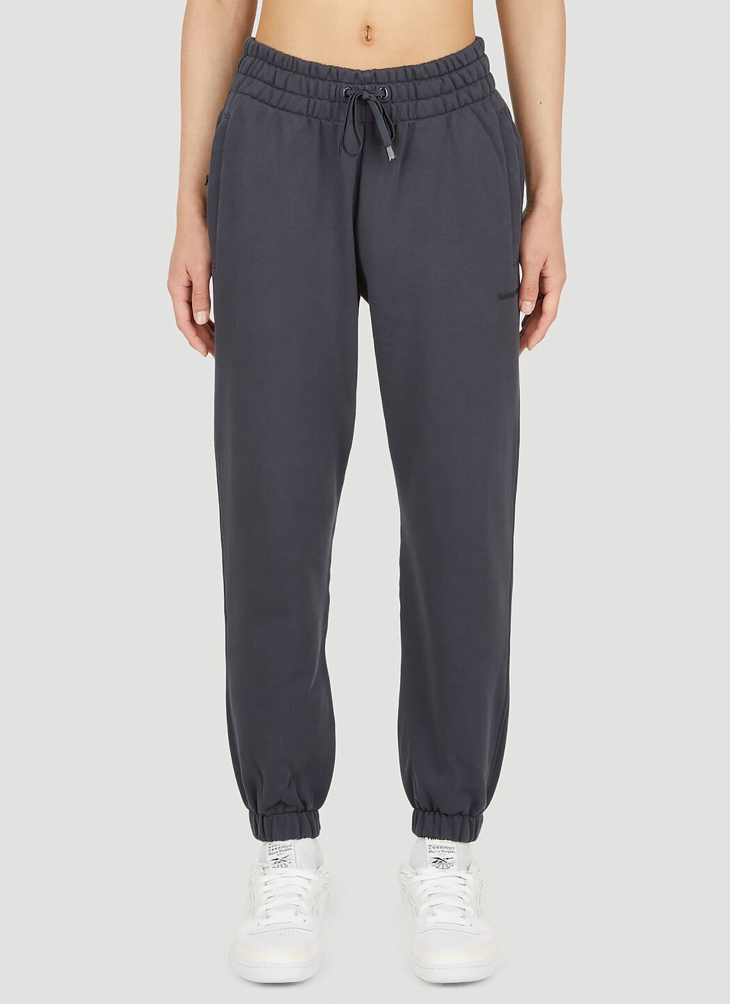 Adidas human race cheap track pants