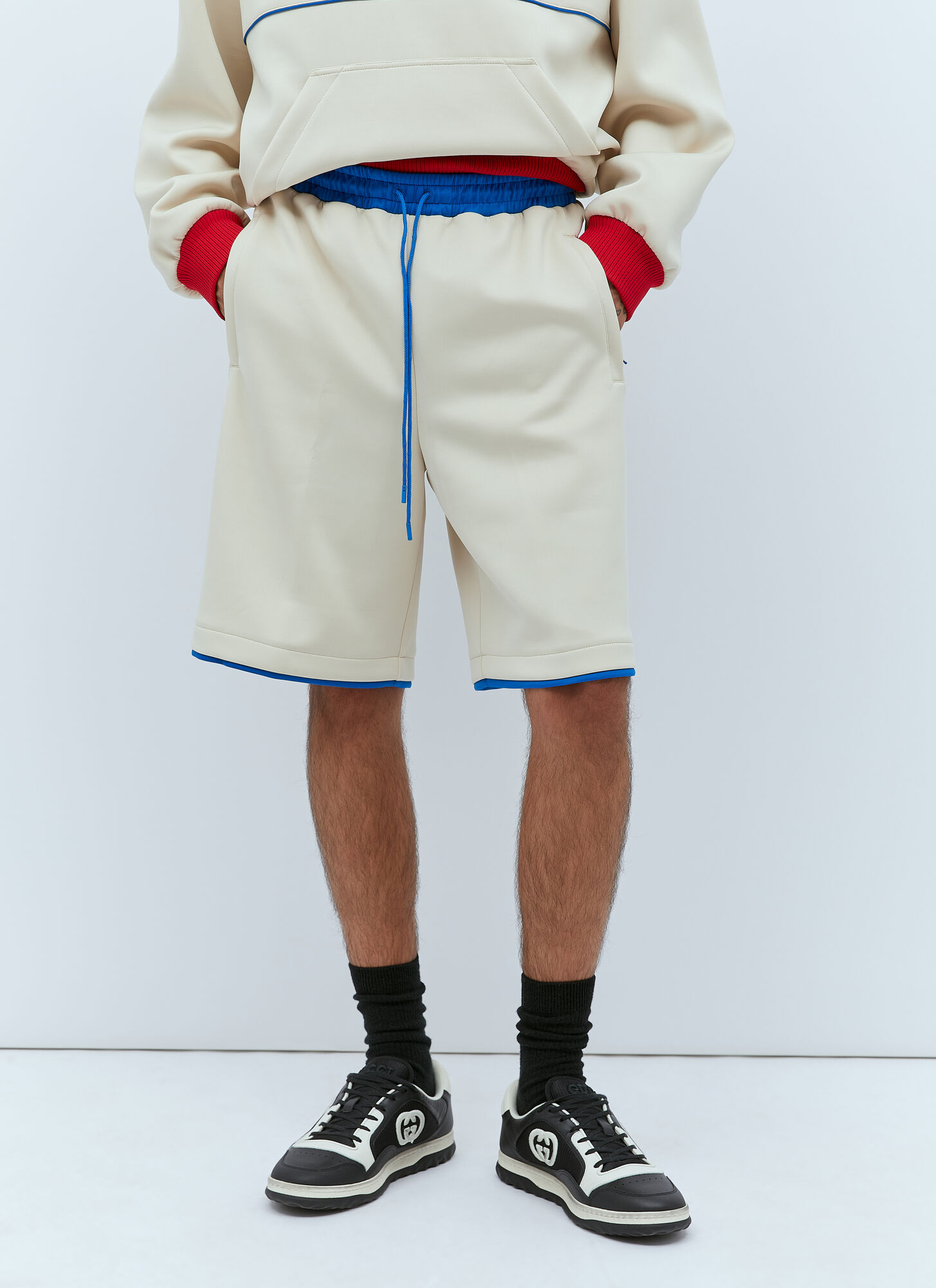 Shop Gucci Logo Embossed Basket Shorts In Beige