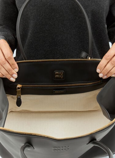 Miu Miu Logo Embossed Leather Handbag Black miu0258050