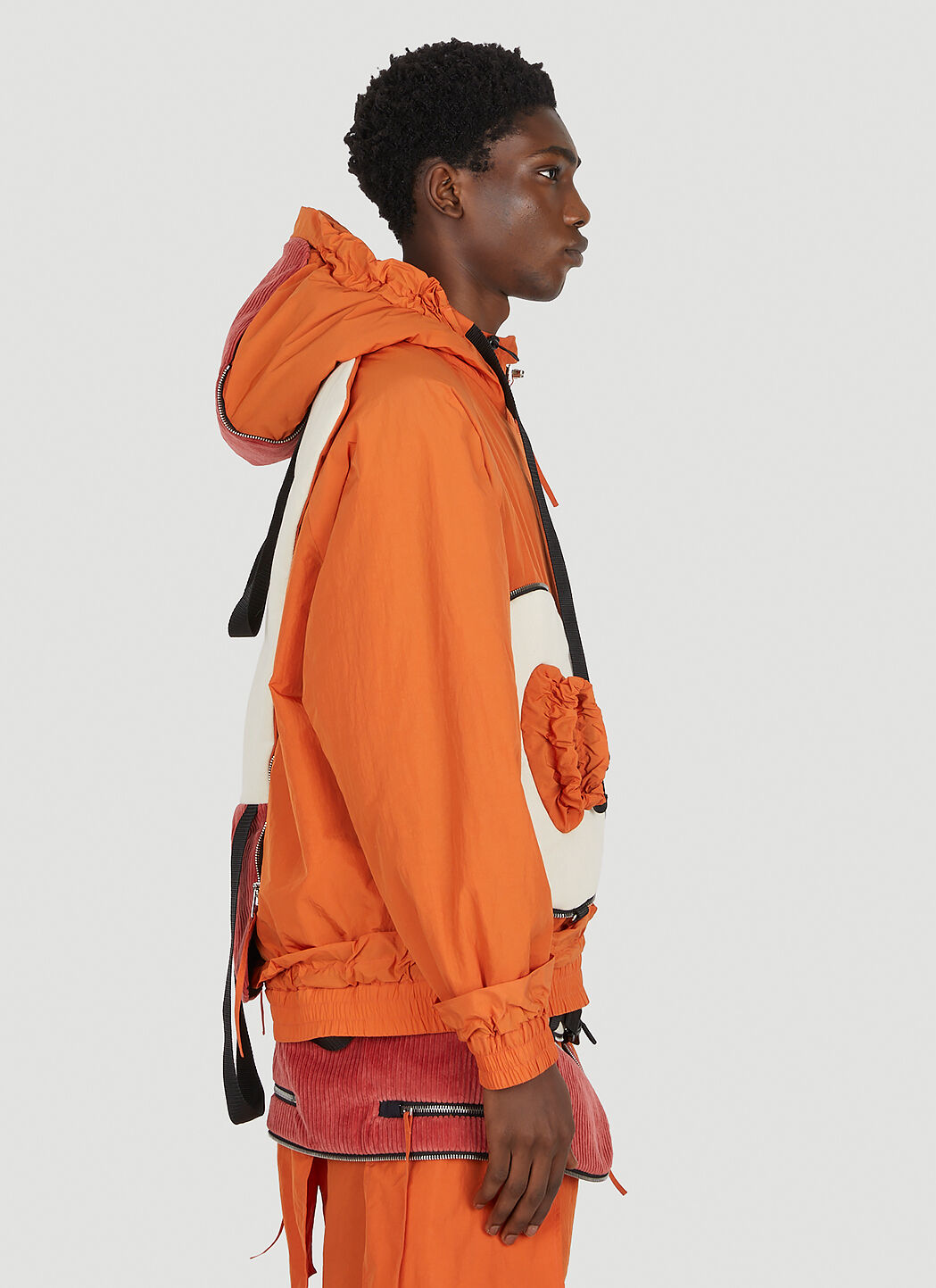 Green top orange jacket