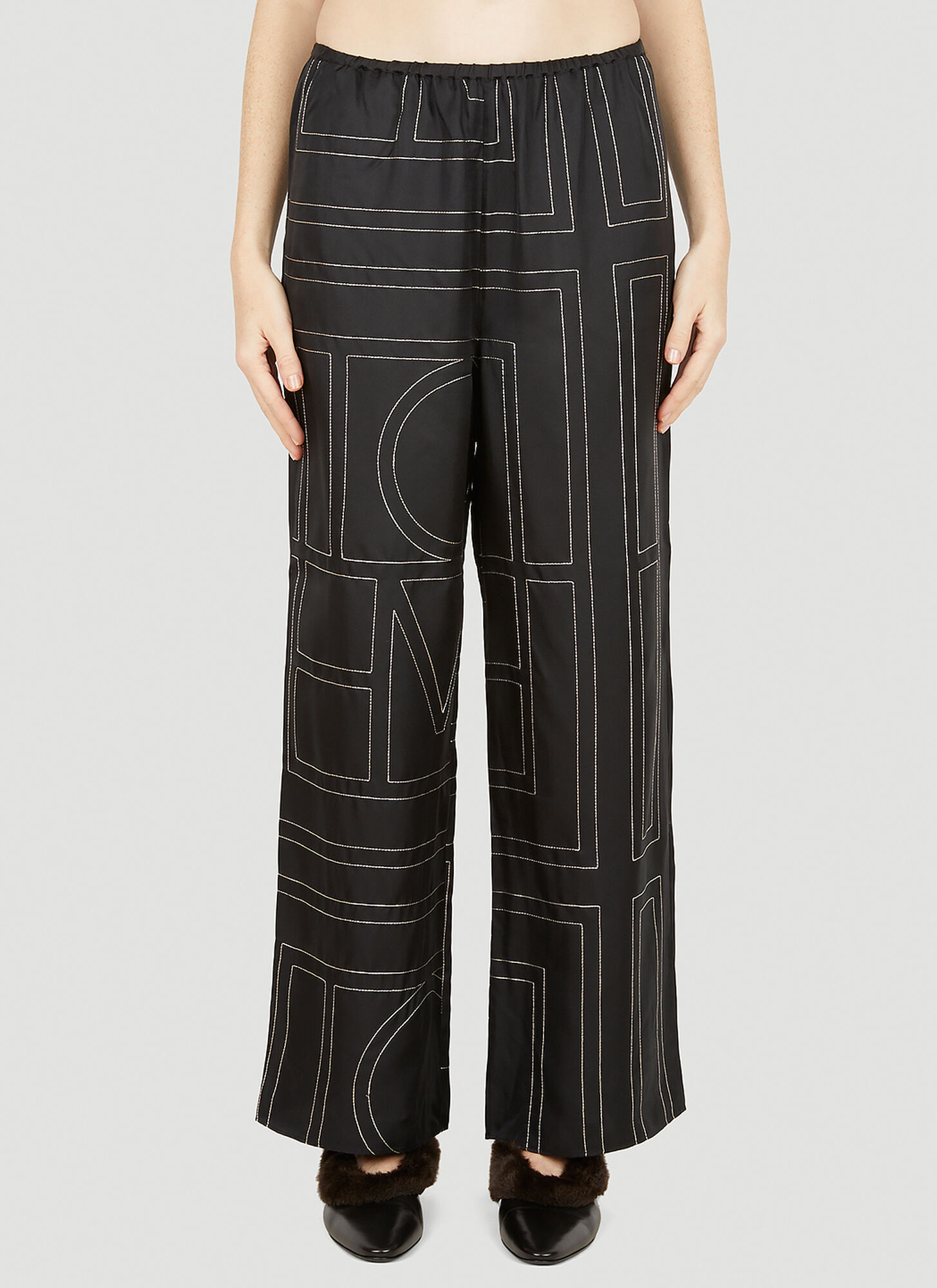 Shop Totême Monogram Pants In Black