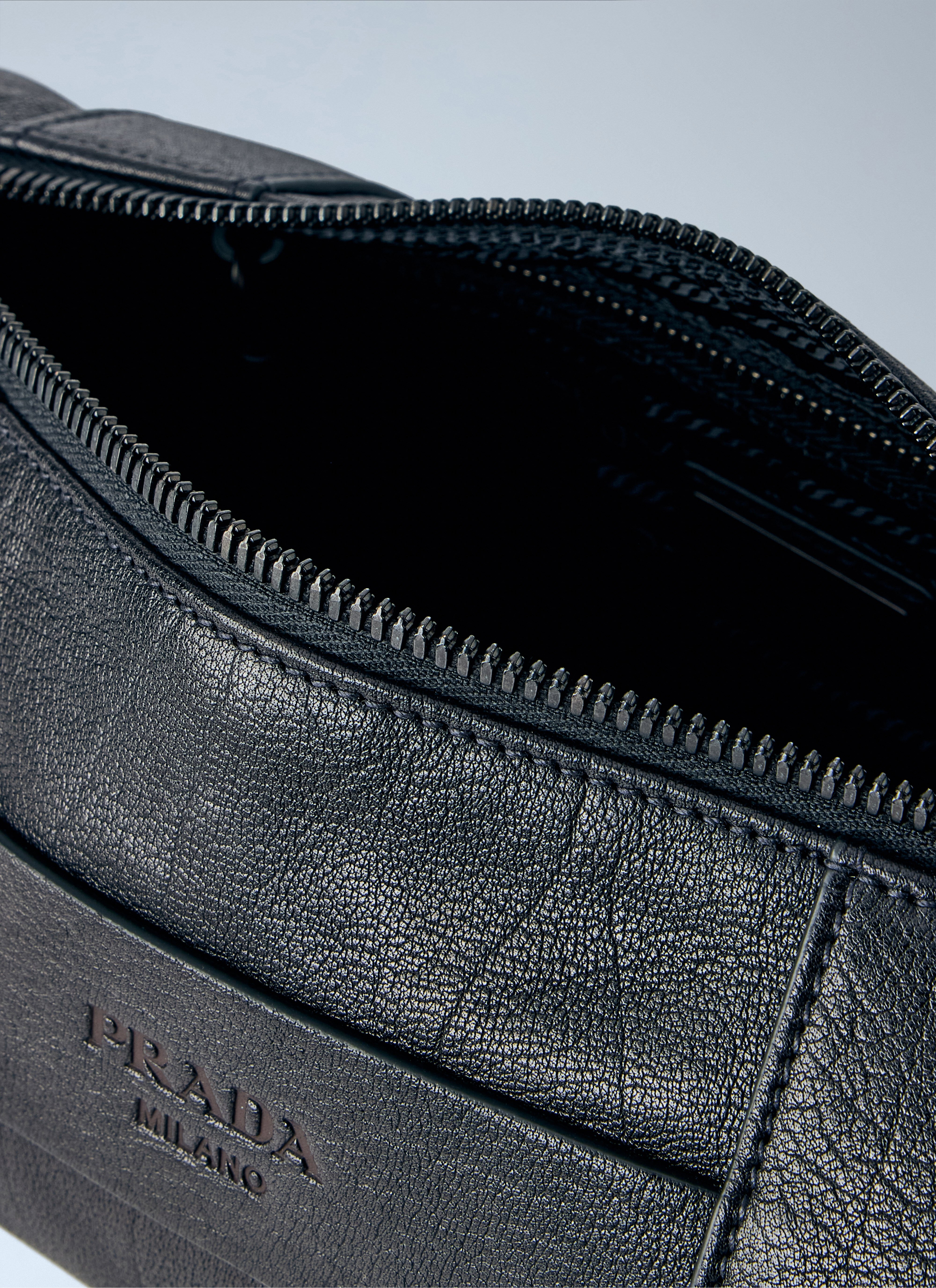 Prada Men's' Eyelet Detail Leather Cylinder Bag in Black | LN-CC®