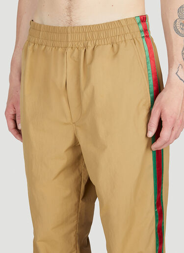ウェブストライプ トラックパンツ Gucci ウェブストライプ トラックパンツ キャメル guc0153047