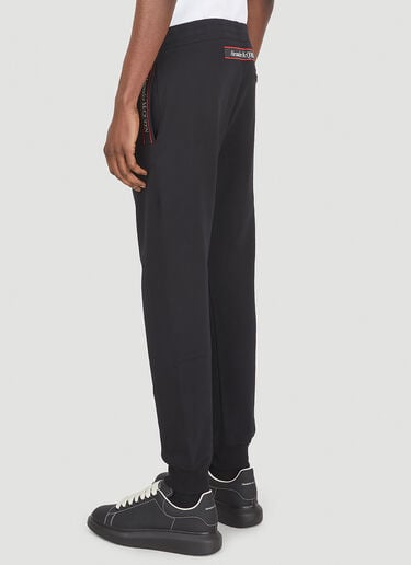 ロゴテープトラックパンツ Alexander McQueen ロゴテープトラックパンツ ブラック amq0147017