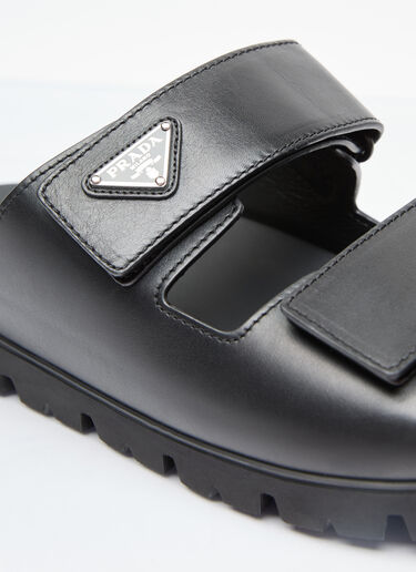 Prada 로고 플라크 가죽 슬라이드 블랙 pra0156014