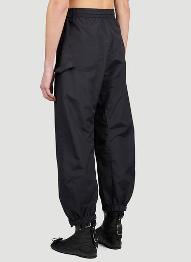 JW Anderson 앵커 자수 로고 트위스트 트랙 팬츠 블랙 jwa0154002