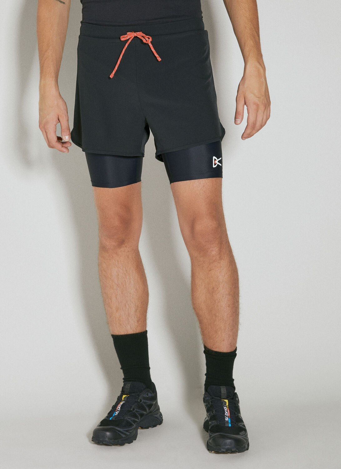 District Vision Layered Pocketed Trail Shorts In Black