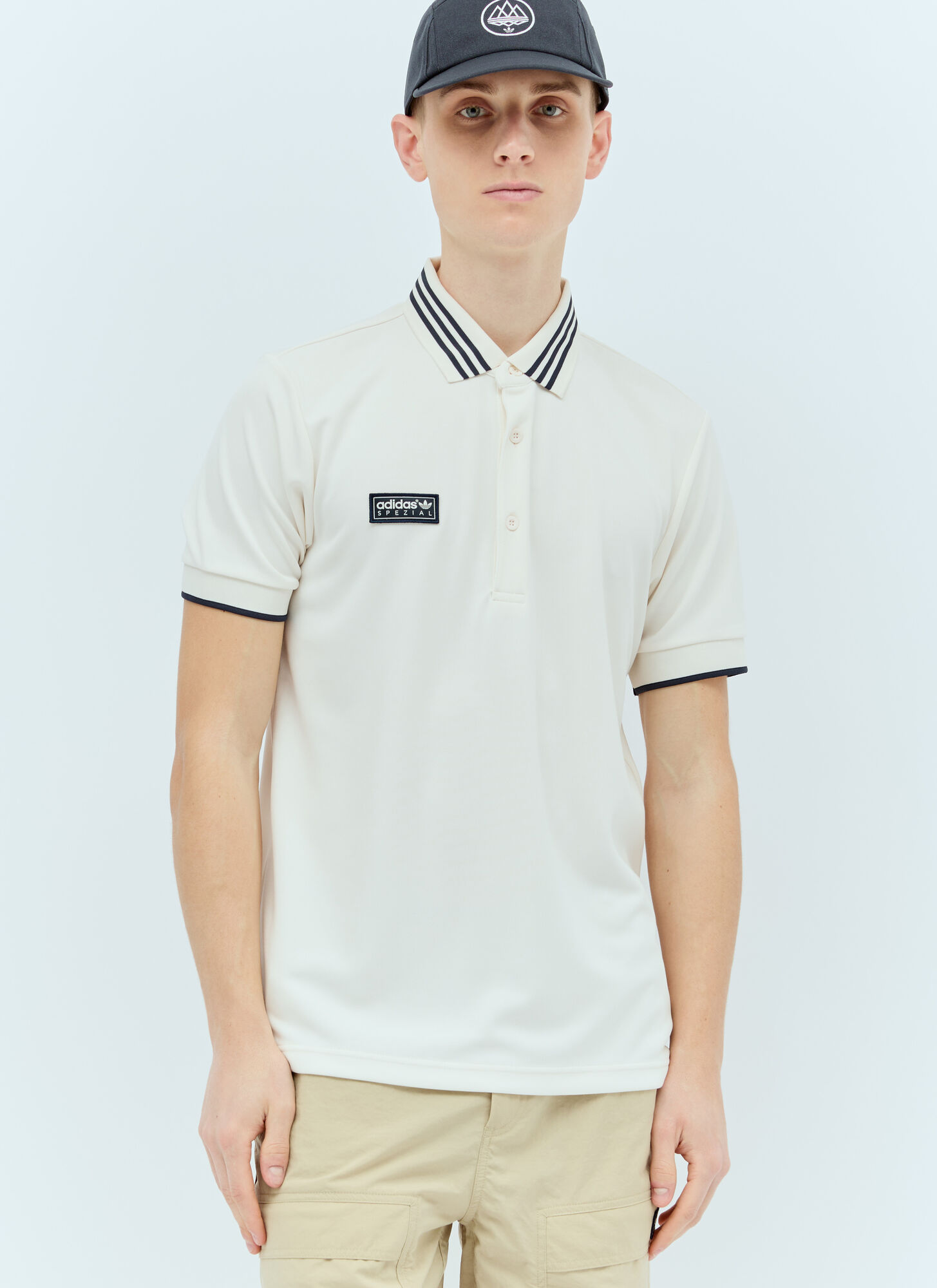 Shop Adidas Originals By Spzl Logo Patch Polo Shirt In White