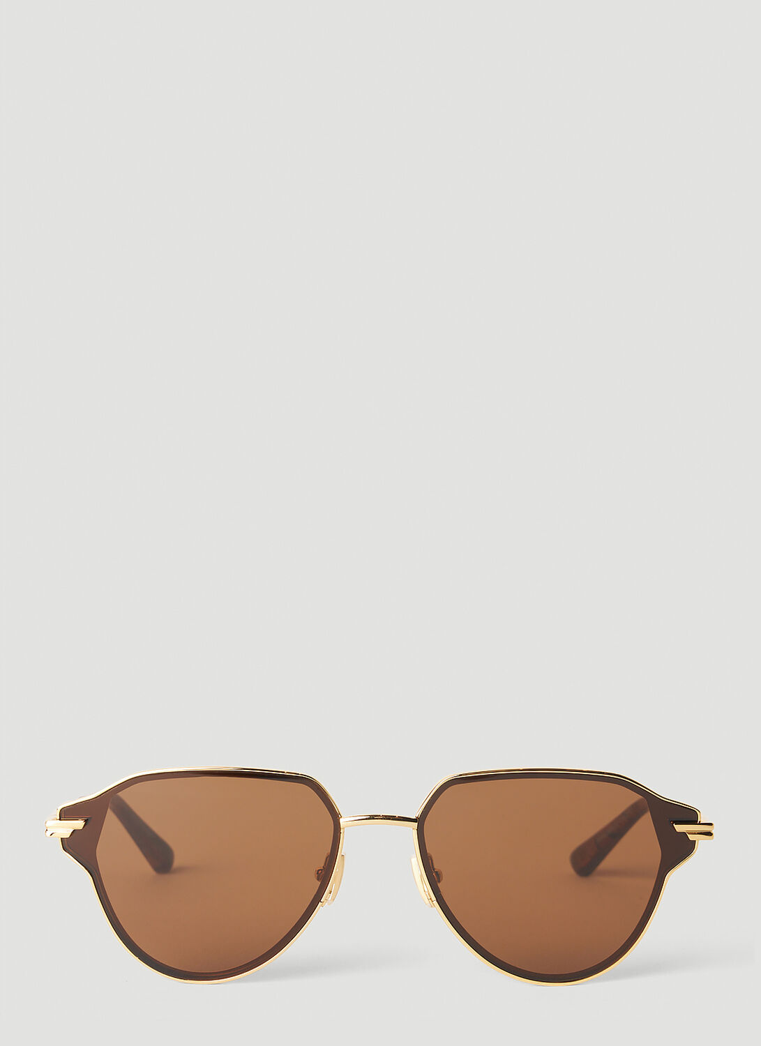 Shop Bottega Veneta Navigator Frame Sunglasses In Gold