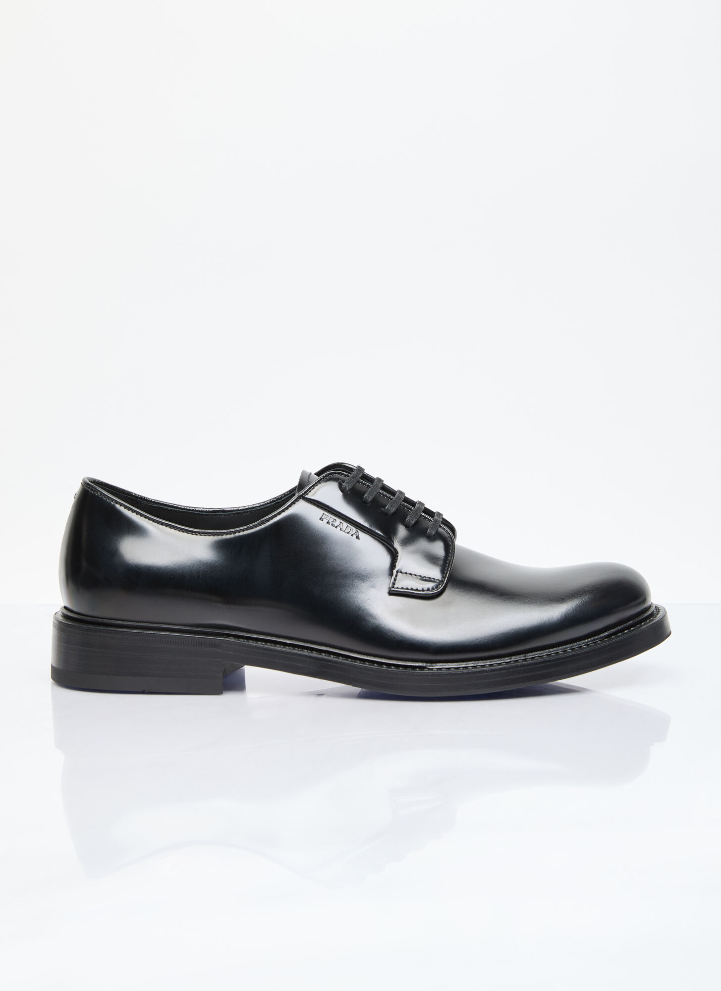 Shop Prada Brushed Leather Lace-up Shoes In Black