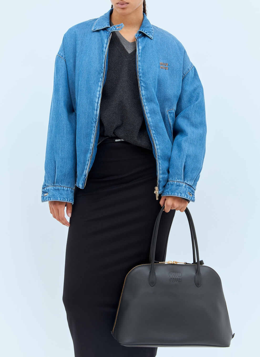 Miu Miu Logo Embossed Leather Handbag In Black