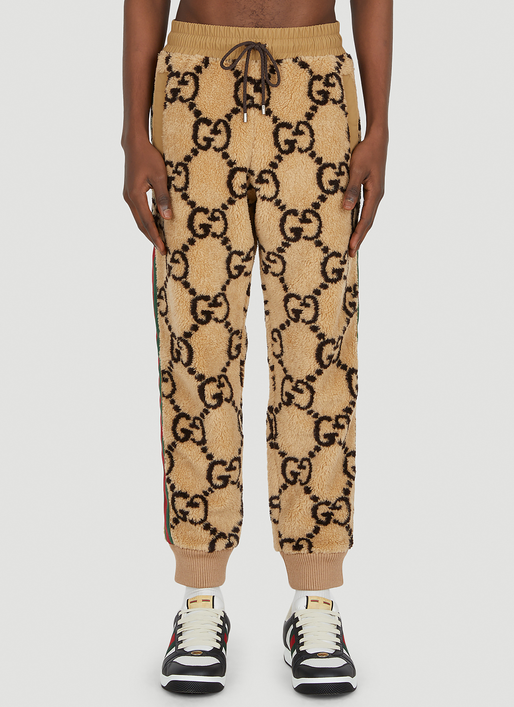GUCCI Pants Men, Beige trousers with GG cuff Beige